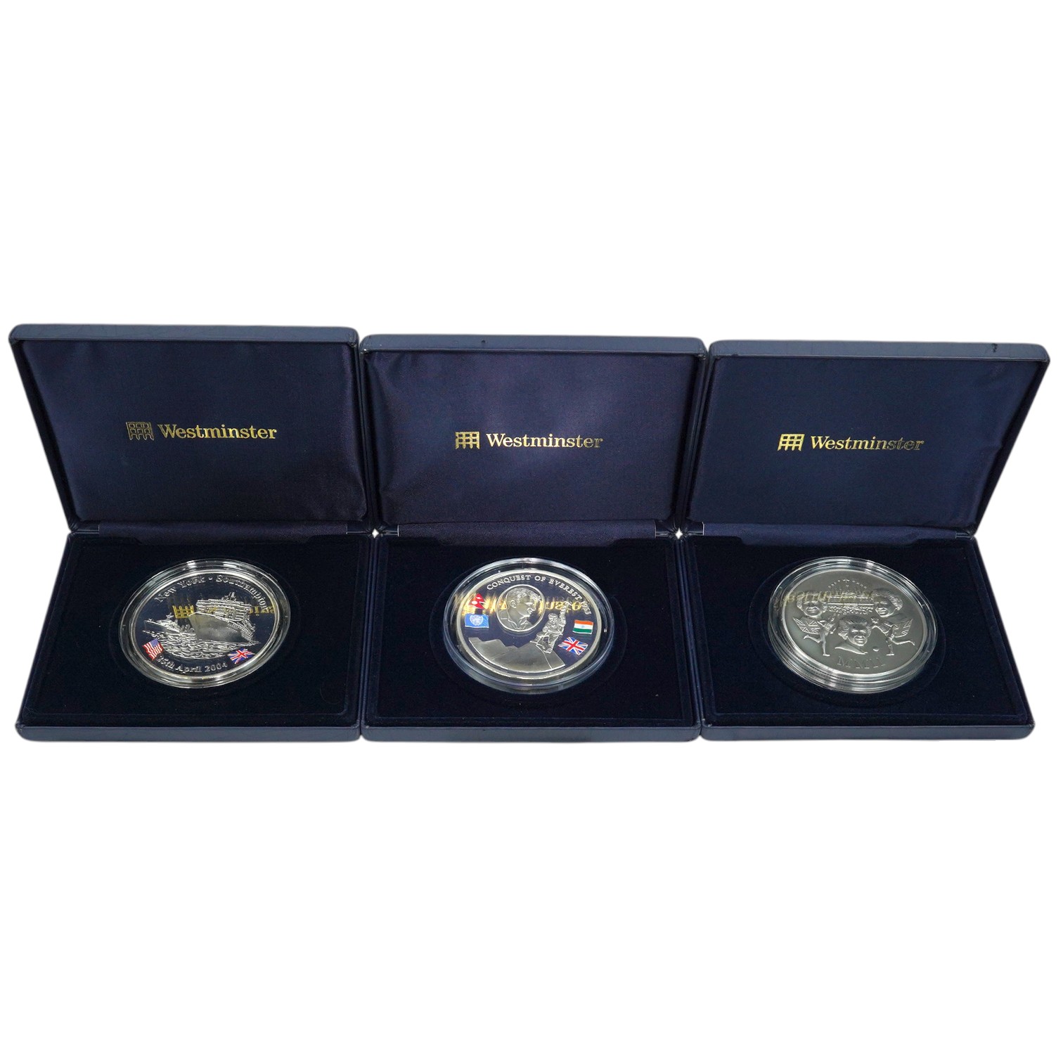 Westminster mint, three 5oz. silver commemorative medals; 2002 annual history, 2003 50th anniversary of the conquest of Everest and 2004 great liners, in case of issue with certificate, limited editions of 300 and 500.